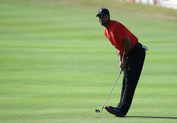 Tiger Woods watches his shot from the 14th fairway during Sunday's final round at the Hero World Challenge in Nassau, Bahamas.