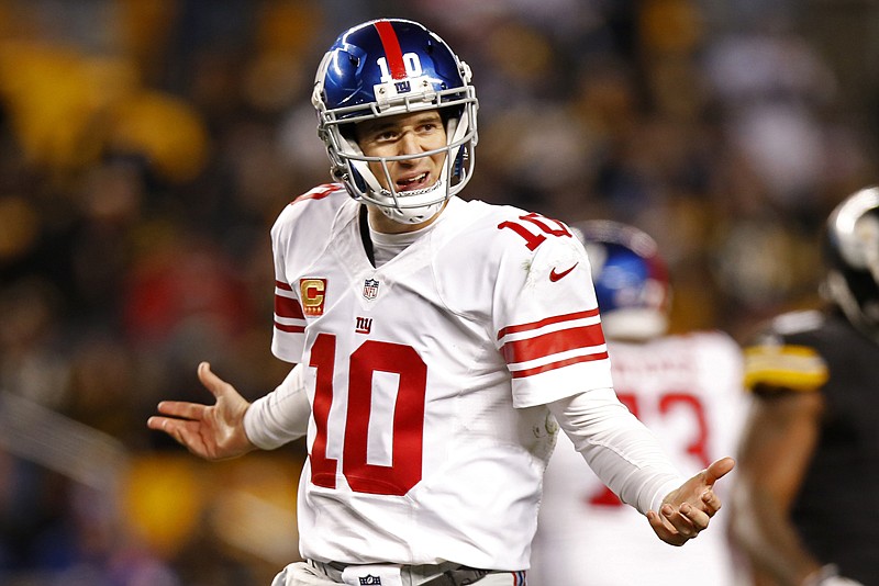 New York Giants quarterback Eli Manning questions a non-call by the referee Sunday during the second half against the Pittsburgh Steelers in Pittsburgh.