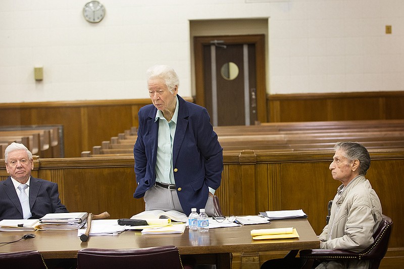 Ronald Antoniello, 73, right, listens as his attorneys Carolyn Whitefield and Garnet Norwood present Antoniello's case Tuesday. Antoniello of Fouke, Ark., is charged with 30 counts of possessing, distributing or viewing material depicting the sexual exploitation of children.
