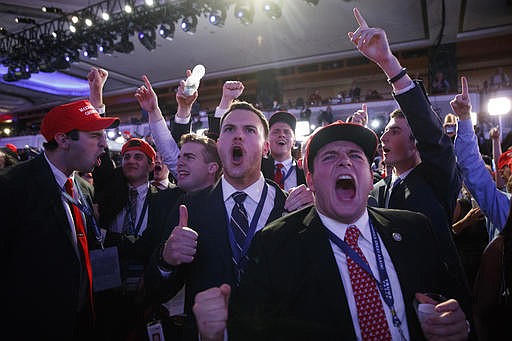  In this Nov. 9, 2016 file photo, supporters of President-elect Donald Trump cheer during as they watch election returns during an election night rally in New York. Among the youngest white adult Americans, feelings of racial and economic vulnerability appear to be closely connected to their support for Donald Trump in last month's election. 