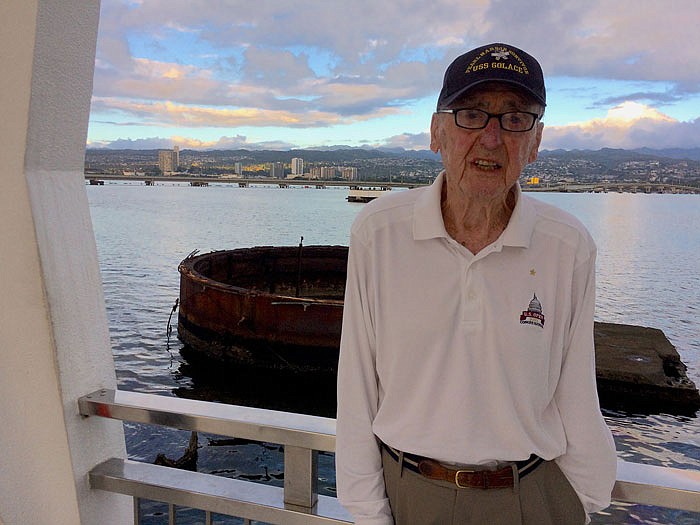 Retired U.S. Navy corpsman Bill McAnany stands on the USS Arizona Memorial. He is in Honolulu, Hawaii, to commemorate the 75th anniversary today of the attacks on Pearl Harbor, which he survived.