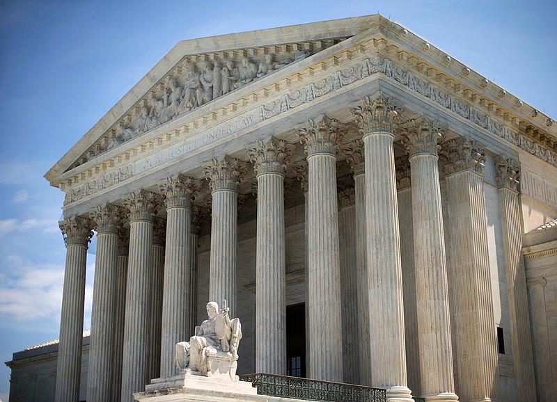 In this June 30, 2014 file photo, the Supreme Court building is seen in Washington. A unanimous Supreme Court on Tuesday, Dec. 6, 2016, sided with the government in a legal clash over the nation's insider trading laws, a victory for prosecutors seeking to curb corruption on Wall Street. 