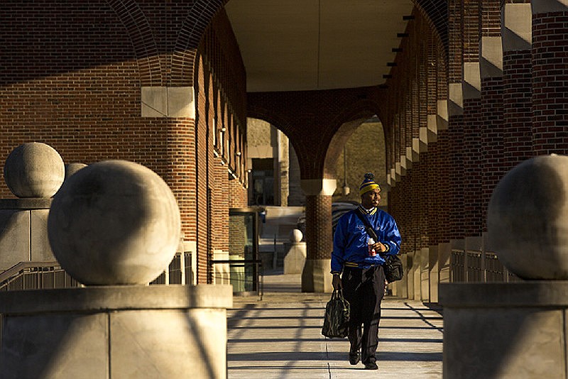 A Lincoln University student crosses the bridge from Page Library on Lincoln's campus on April 30, 2016.