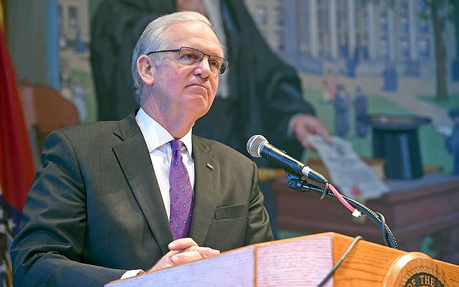 Gov. Jay Nixon hosts a news conference Wednesday about the state budget in his office at the Capitol. Nixon restricted $51 million of budgeted spending.