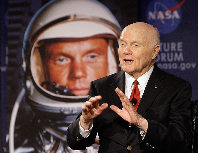 U.S. Sen. John Glenn talks with astronauts on the International Space Station via satellite before a 2012 discussion titled "Learning from the Past to Innovate for the Future" in Columbus, Ohio. Glenn, who was the first U.S. astronaut to orbit Earth and later spent 24 years representing Ohio in the Senate, has died at 95. 