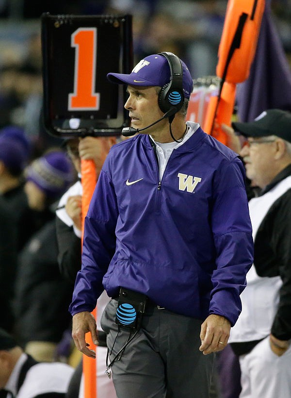 Washington head coach Chris Petersen stands on the sideline during a game last month against Arizona State in Seattle. Petersen will coach a College Football Playoff game for the first time Dec. 31.
