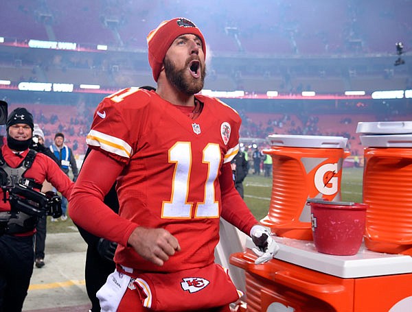 Chiefs quarterback Alex Smith celebrates following Thursday night's game against the Raiders in Kansas City. The Chiefs won 21-13 to take first place in the AFC West standings.