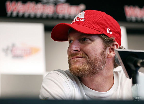 In this Aug. 5 file photo, Dale Earnhardt Jr. listens to a question about his concussion while addressing the media at Watkins Glen International in Watkins Glen, N.Y. Earnhardt's test at Darlington Raceway this week was the final hurdle for him to be cleared to race next season.