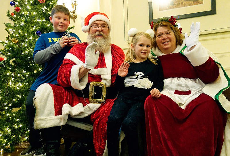 Santa and Mrs. Claus get cozy with Jack Stubbs and Lilianna McClanahan-Yelton on Saturday, Dec. 10, 2016 at the National Churchill Museum's annual Christmas tea. The tea included plenty of children's activities. Jack, 9, said he wants a LEGO Batman set in particular this Christmas, while Lilianna hopes for a canine FurReal Friends pet.