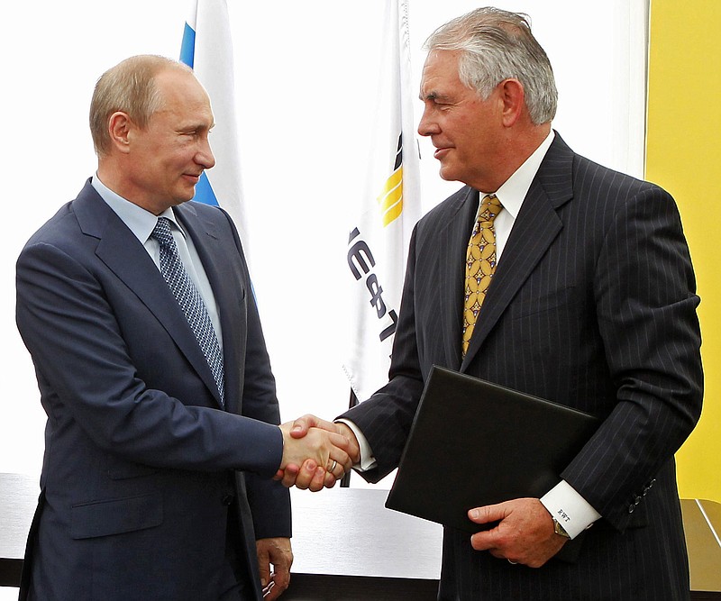 In this June 15, 2012, file photo, Russian President Vladimir Putin, left, and ExxonMobil CEO Rex Tillerson, now secretary of state-designate, shake hands at a signing ceremony of an agreement between state-controlled Russian oil company Rosneft and ExxonMobil at the Black Sea port of Tuapse, southern Russia. If there's one thing Republicans and Democrats have agreed on in foreign policy, it is the power of sanctions. Both have levied economic penalties on foreign governments, pressuring Iran into nuclear concessions or Myanmar into democratic reform. But Donald Trump's choice for secretary of state has seen things differently. 