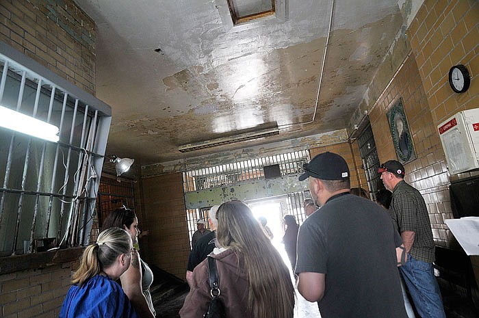 A group of tourists visit the old Missouri State Penitentiary. Tours at the former prison have spiked by 25 percent this year. 