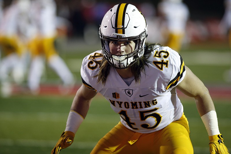 Wyoming linebacker Lucas Wacha warms up before the start of an NCAA college football game against New Mexico in Albuquerque, N.M., Saturday, Nov. 26, 2016.  Wacha is a Pleasant Grove graduate.