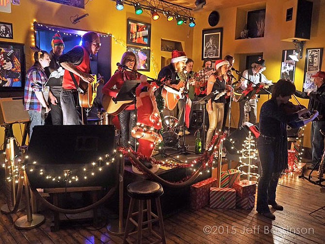 Musicians perform during last year's "Holiday Hootenanny" at The Mission. Multiple performers will be back Friday in the second annual fundraising concert. 