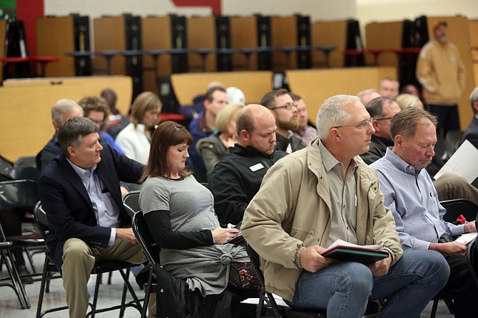 Members of the public listen during a Thursday JCPS School Board meeting at Lewis and Clark Middle School. The board held the session for the public to comment/ask questions about the potential bond issue to build a second high school.