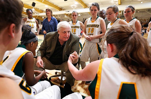 West Virginia Gov.-elect Jim Justice talks with Morgan Amos (right) and the rest of his Greenbrier East High School team during a girls basketball game earlier this month in Lewisburg, W.Va.