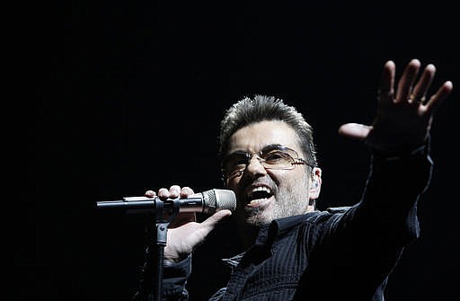 In this June 25, 2008, file photo, singer George Michael performs during his "Live Global Tour" concert in Inglewood, Calif. Michael, who rocketed to stardom with WHAM! and went on to enjoy a long and celebrated solo career lined with controversies, has died, his publicist said Sunday, Dec. 25, 2016. He was 53.