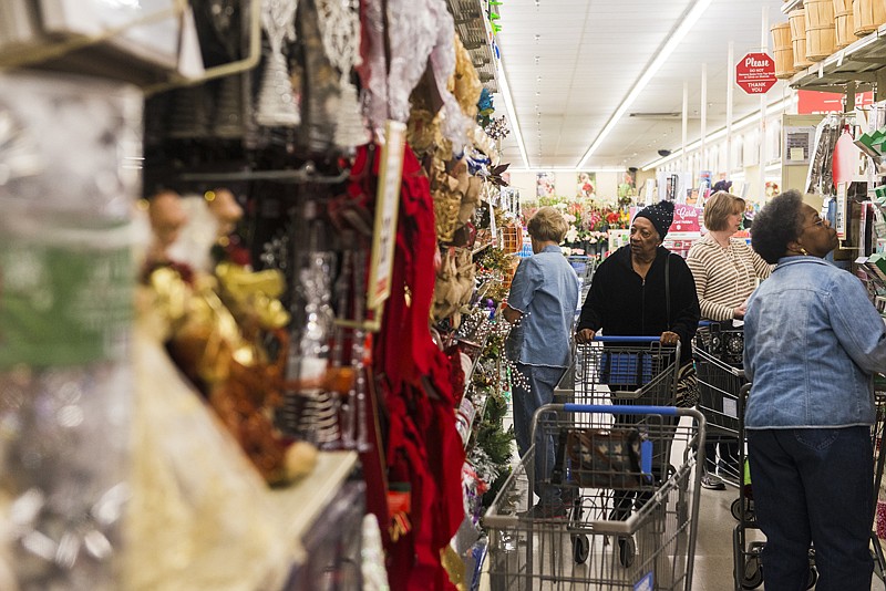 Shoppers take advantage of after-Christmas sales on holiday decorations Monday at Hobby Lobby. The sale on remaining decorations continues until items are sold out.
