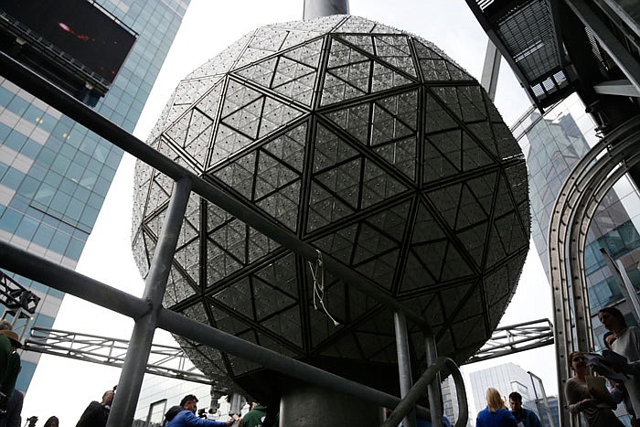 The New Year's Eve ball rests Tuesday at the top of a building overlooking Times Square, in New York.