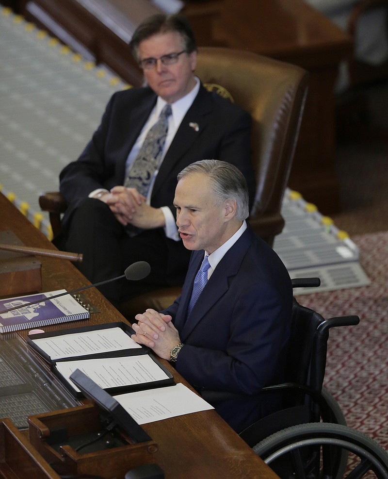 In this Feb. 17, 2016 file photo, Texas Gov. Greg Abbott, right, delivers his State of the State address to a joint session of the House and Senate in Austin, Texas. Texas Lt. Gov. Dan Patrick is at left. The top two Republican leaders in Texas continue to downplay a possible intraparty battle for governor in 2018, despite Patrick's repeated efforts to move to Abbott's right on key conservative issues.