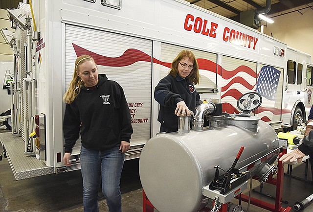 Cara and Lisa Wehmeyer look over the new training equipment purchase made possible by a contribution from Phillips 66 Pipeline. The donation made it possible for the Cole County Emergency Response Team, or CERT, to acquire necessary and valuable training equipment that can simulate a tanker truck rollover.