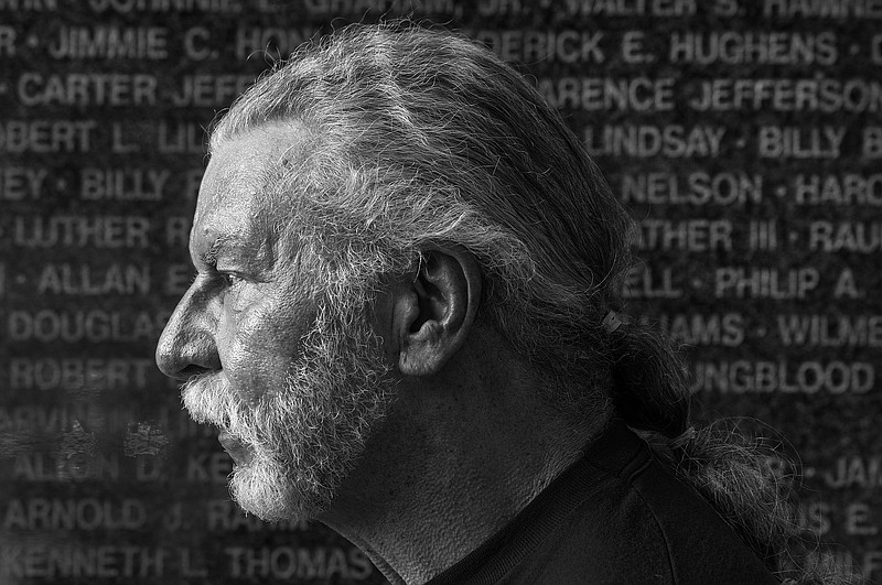 Vietnam Veteran and 30-year veterans' advocate Greg Beck poses for a portrait in front of the Texarkana Korea/Vietnam Memorial in downtown Texarkana. 