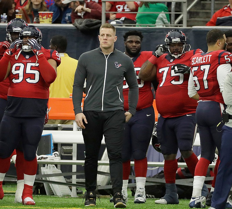 In a Sunday, Dec. 18, 2016 file photo, Houston Texans defensive end J.J. Watt watches from the sideline for the first time since his season-ending back injury during the first half of an NFL football game against the Jacksonville Jaguars, in Houston. Watt missed all but three games with a back injury that required surgery. But 2014 top overall pick Jadeveon Clowney moved from outside linebacker to help account for the loss, and the Texans are headed to the playoffs for the second consecutive season.