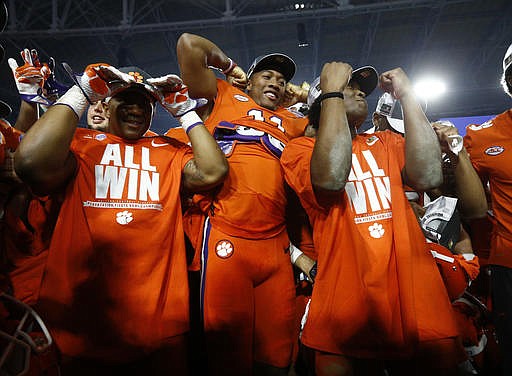 Clemson players celebrate after Clemson defeated Ohio State 31-0 in the Fiesta Bowl NCAA college football playoff semifinal, Saturday, Dec. 31, 2016, in Glendale, Ariz. Clemson advanced to the BCS championship game Jan. 9 against Alabama. 