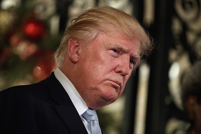 In this Wednesday, Dec. 28, 2016, file photo, President-elect Donald Trump listens to a question as he speaks to reporters at Mar-a-Lago, in Palm Beach, Fla.