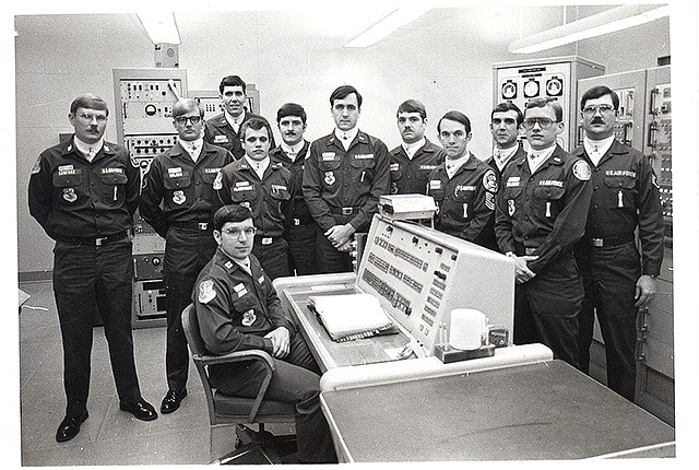 In this undated photo, Allan Childers, second right, poses with others on a Titan II missile crew at Damascus, Ark. Childers was deputy commander of the crew in 1980, when an airman performing maintenance in the missile silo dropped a socket that pierced the rocket's fuel tank. The accident triggered an explosion 10 hours later, throwing a 9-megaton nuclear warhead into a ditch 200 yards away. PBS' American Experience series will show the documentary "Command and Control" on Tuesday.