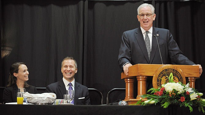 Gov. Jay Nixon, right, started off his speech Thursday with lighthearted remarks, causing laughter to erupt in the crowd, including Sheena and Gov.-elect Eric Greitens during the 2017 Governor's Prayer Breakfast.