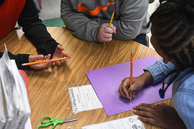 Nash Elementary students work on classwork together Friday. Local Texas school officials disagree with the methodology of the new A-F school accountability system. 