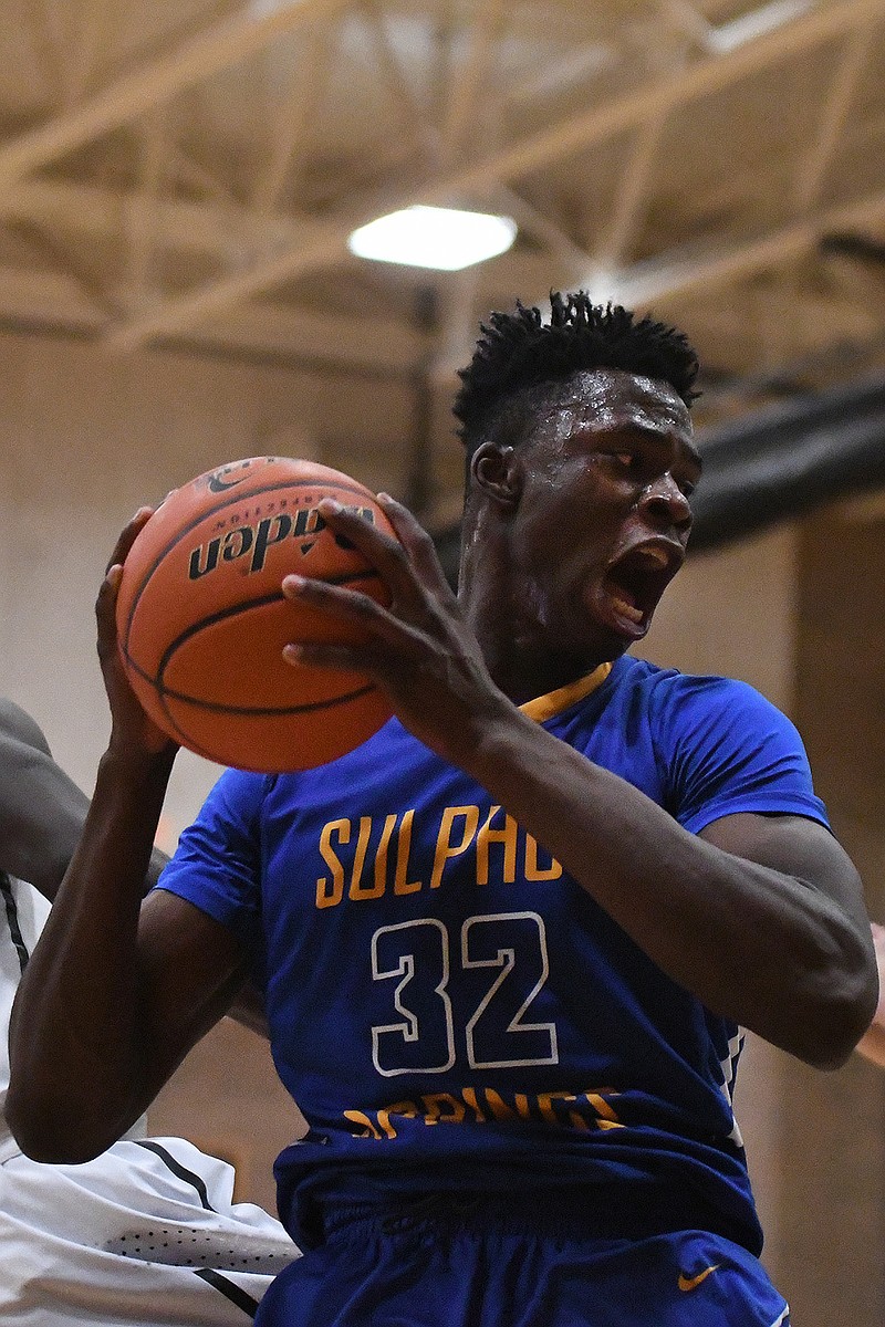 Sulphur Springs' Victor Iwuakor, 32, yells after making a rebound during the second quarter of their game against Texas High on Friday at the Tiger Center. 