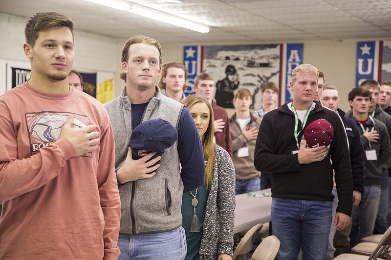 Members of the American Legion World Series winning Texarkana baseball team observe the Pledge of Allegiance on Saturday at the American Legion Post.
