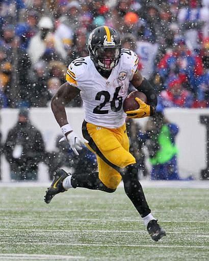 In this Dec. 11, 2016, file photo, Pittsburgh Steelers running back Le'Veon Bell (26) runs against the Buffalo Bills during the second half of an NFL football game, in Orchard Park, N.Y. 