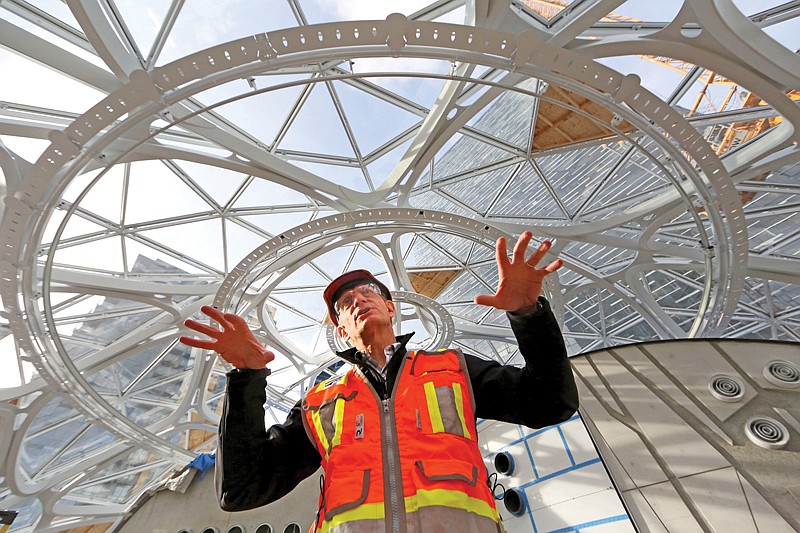 Architect Dale Alberda, lead designer of the Amazon Spheres, describes the complex design of the three domes Nov. 17, 2016, while standing near the top of the structure.
