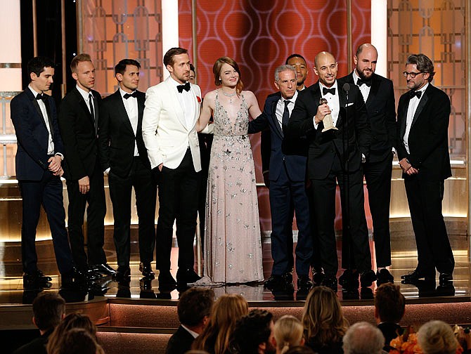 This image shows the cast and crew of "La La Land," winner of the award for best motion picture musical or comedy Sunday at the 74th annual Golden Globe Awards at the Beverly Hilton Hotel.