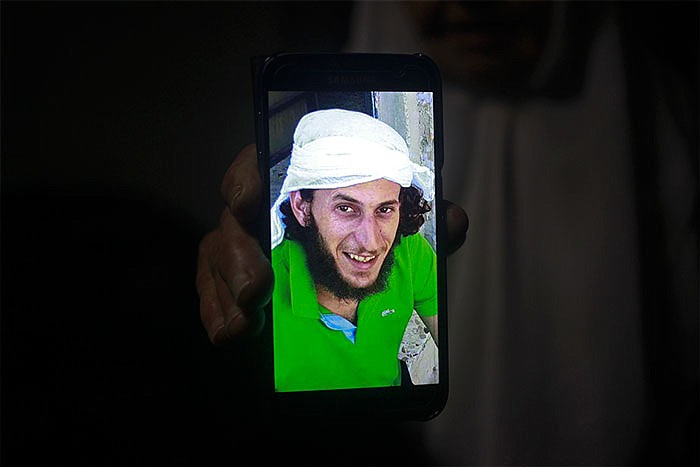 A relative shows a mobile phone photo of Fadi Qunbar, 28, outside his home in Jerusalem. Qunbar was identified as the man who drove a truck into a group of Israeli soldiers in Jerusalem Sunday, killing four people and wounding 15 others