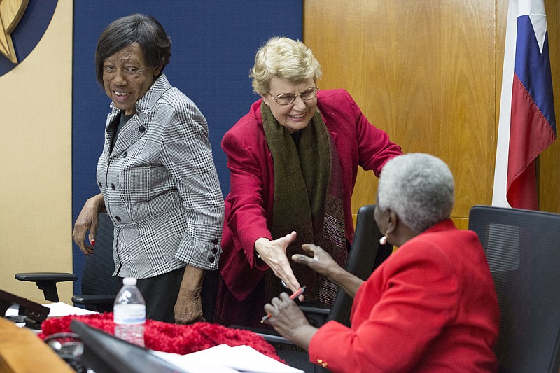 Betty Williams, center, the newly appointed Texarkana, Texas, Ward 3 City Council member, shakes hands Monday evening with Ward 1 Council Member Jean Matlock at City Hall as Ward 2 Council Member Willie Ray looks on.