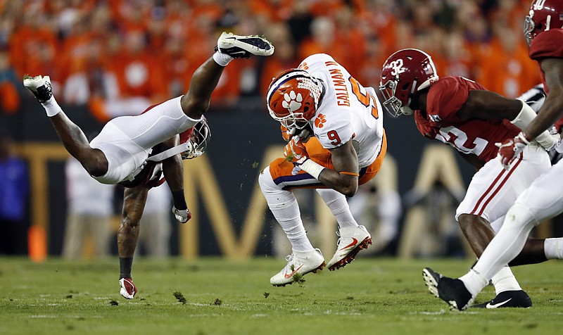 CLEMSON 35, ALABAMA 31. Clemson's Wayne Gallman catches a pass Monday during the first half of the national championship game against Alabama in Tampa, Fla.