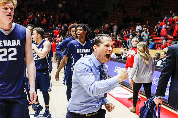 Nevada head coach Eric Musselman celebrates after his team rallied to beat New Mexico in overtime Saturday in Albuquerque, N.M.
