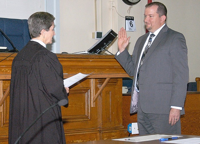 District Circuit Judge Peggy D. Richardson, left, swears in new Associate Circuit Judge Aaron Martin on Jan. 6 in the Moniteau County Courtroom.