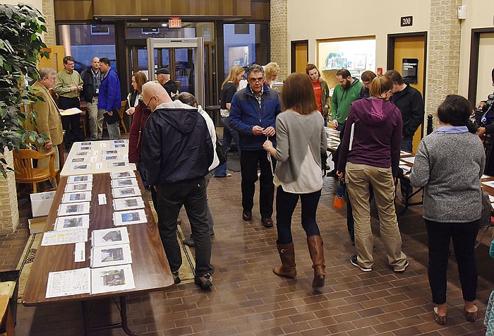 Several dozen interested parties attended a public forum Tuesday evening at City Hall and had to vote for their top five historic properties in the East Capital Avenue area.