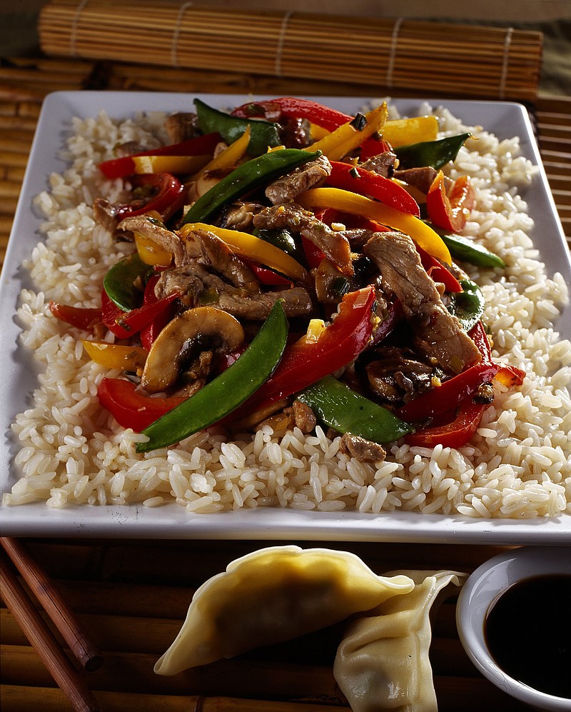 Pork, peppers, mushroom and pea pods make an easy stir-fry that's even better with wine. 