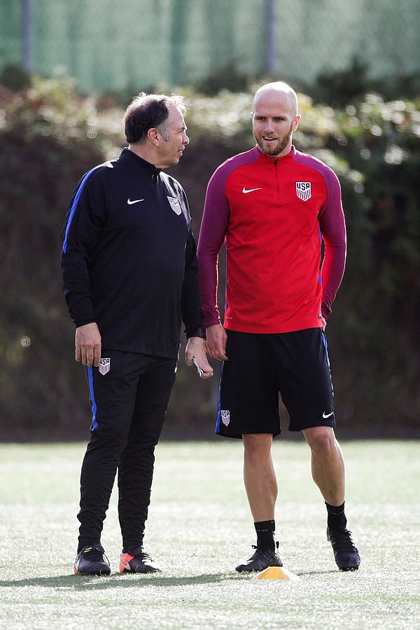 U.S. men's national soccer team coach Bruce Arena (left) talks to captain Michael Bradley during a practice session Wednesday in Carson, Calif. 