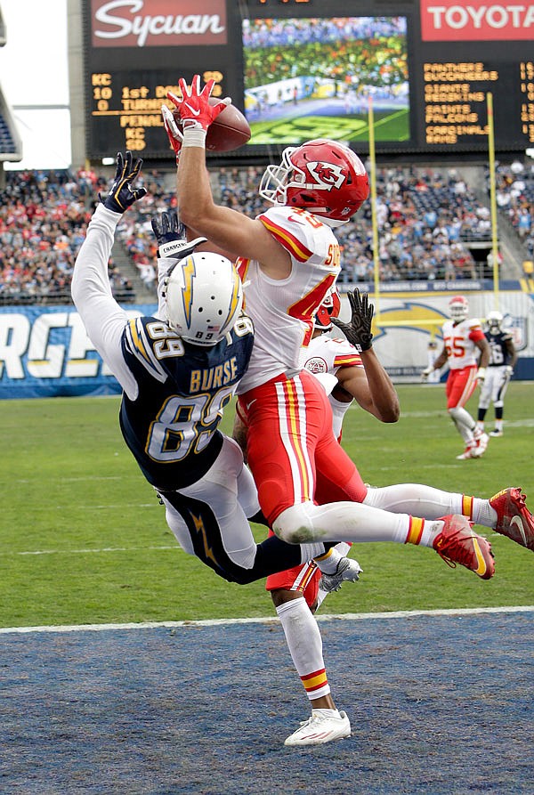Chiefs defensive back Daniel Sorensen intercepts a pass intended for Chargers wide receiver Isaiah Burse during a game earlier this month in San Diego. The Jan. 1 game could be the last time the Chargers play in San Diego.