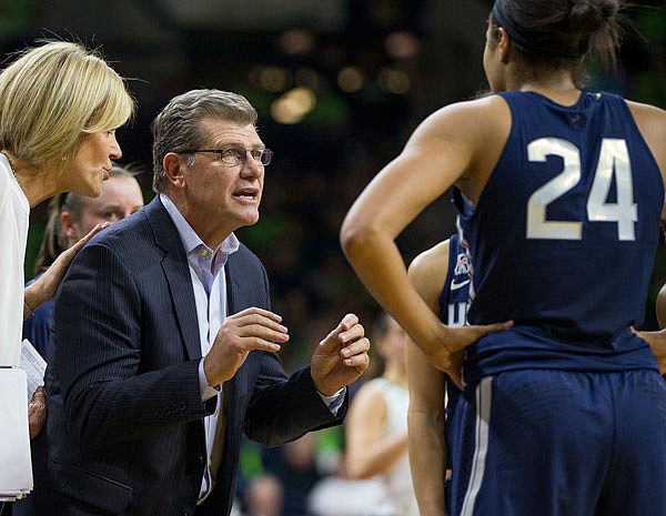 In this Dec. 7, 2016, file photo, Connecticut head coach Geno Auriemma talks to sophomore forward Napheesa Collier (24) and the rest of the Huskies during a timeout in a game against Notre Dame in South Bend, Ind.