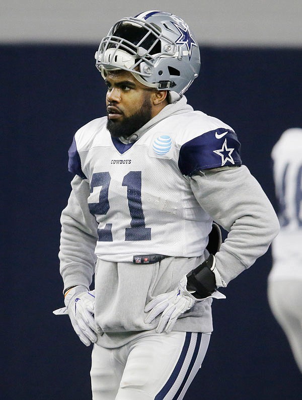 Cowboys running back Ezekiel Elliott walks the field Wednesday during an indoor practice at the team's headquarters in Frisco, Texas. Elliott was in the first group of collegians to go through something resembling the NFL playoffs when Ohio State won the national title in 2015.