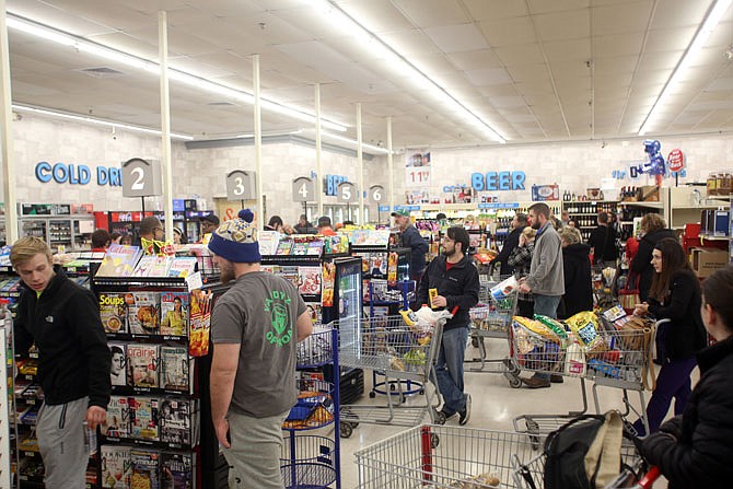 Lanes were full Thursday as people stocked up at Schulte's IGA in preparation for the weekend weather.