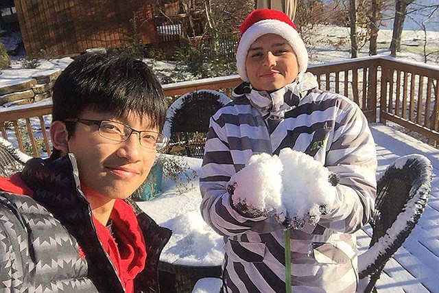 Coming from tropical regions, Yuhao Liu, 16, from China, and Joao Vitor Souza Almeida de Oliveira, 17, from Brazil, saw their first snow and learned how Mid-Missourians get out and about despite below freezing temperatures.