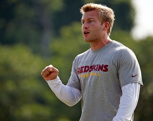 Redskins offensive coordinator Sean McVay talks to his team during training camp last summer in Richmond, Va. The Rams hired McVay as their new head coach Thursday.